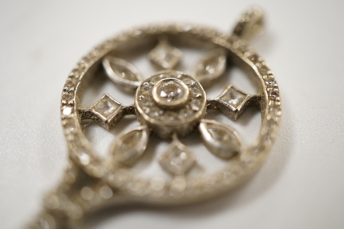 A mid 20th century white metal and diamond cluster set 'key of the door' pendant. 51mm, gross weight 4.6 grams.